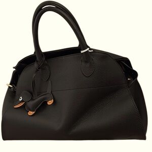 Black Leather Satchel with Structured Design and Charm